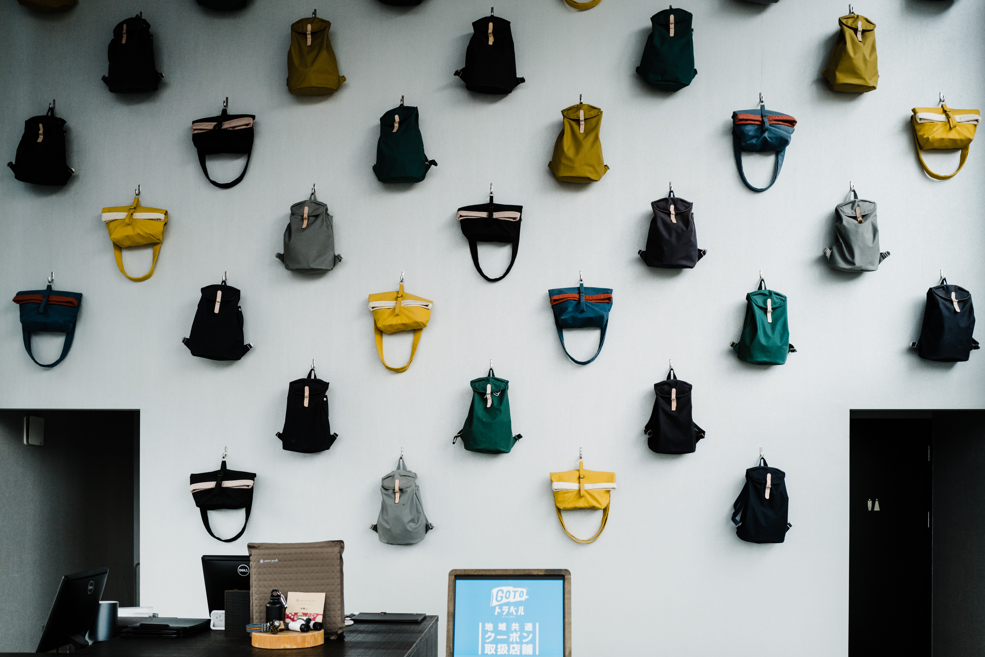 A wall of backpacks at Hoshinoya Fuji.