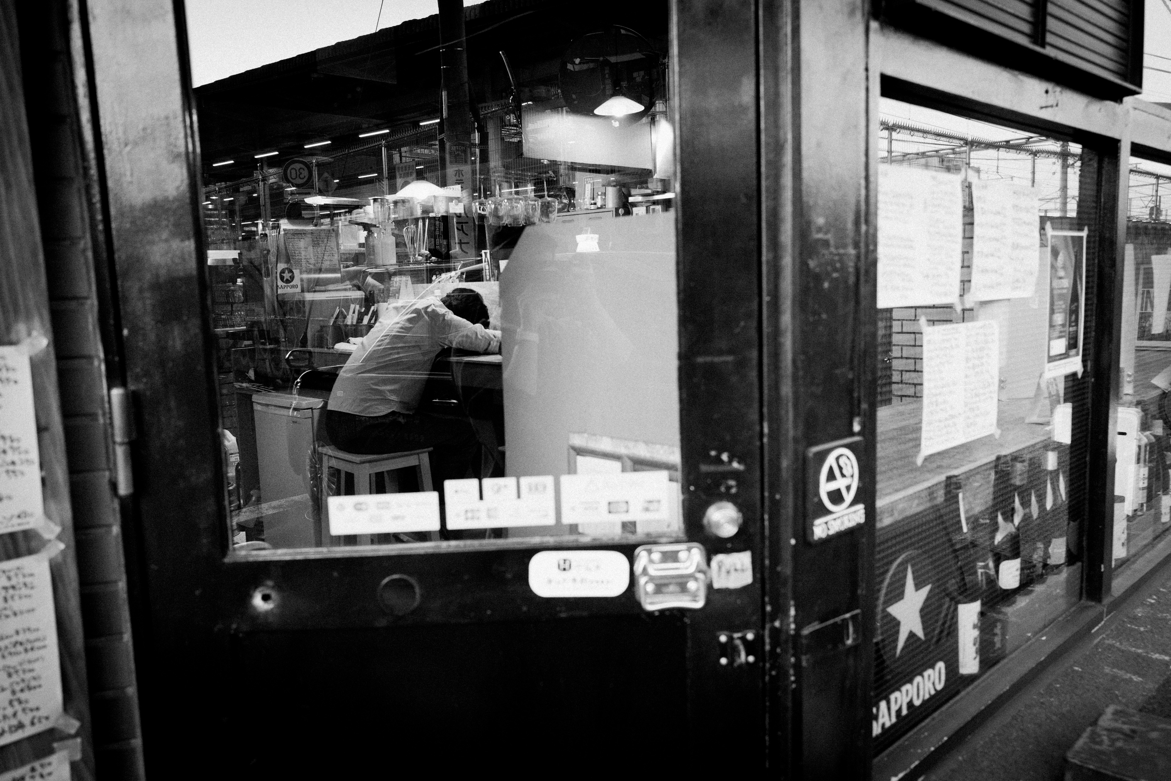 A guy passed out in a bar in Higashinakano.